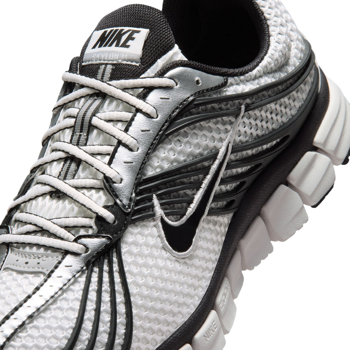 white and black sneakers on a white background