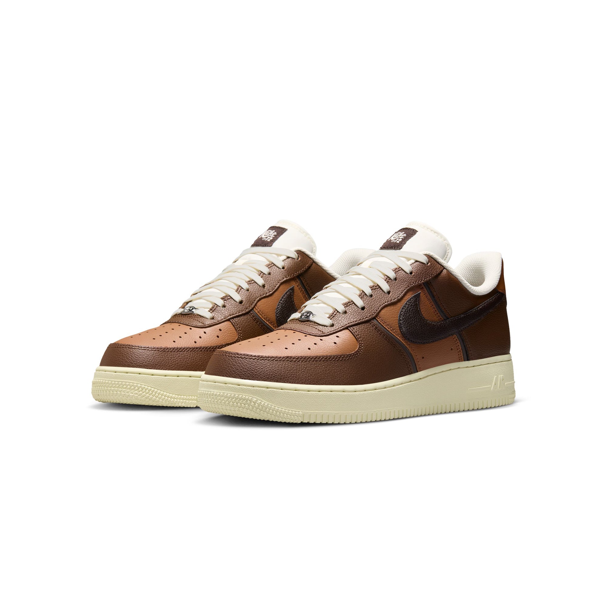brown and tan sneakers on a white background