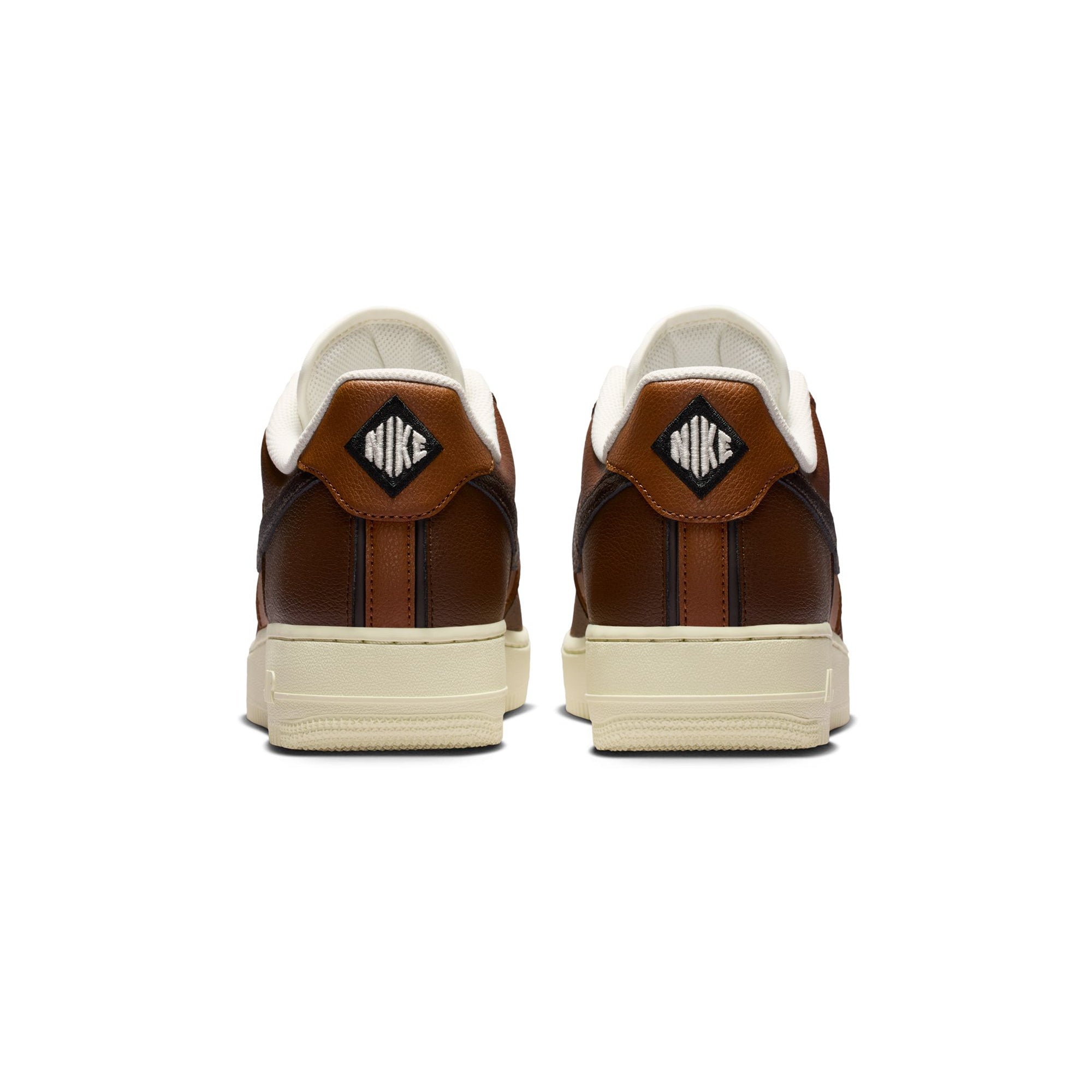 brown and tan sneakers on a white background