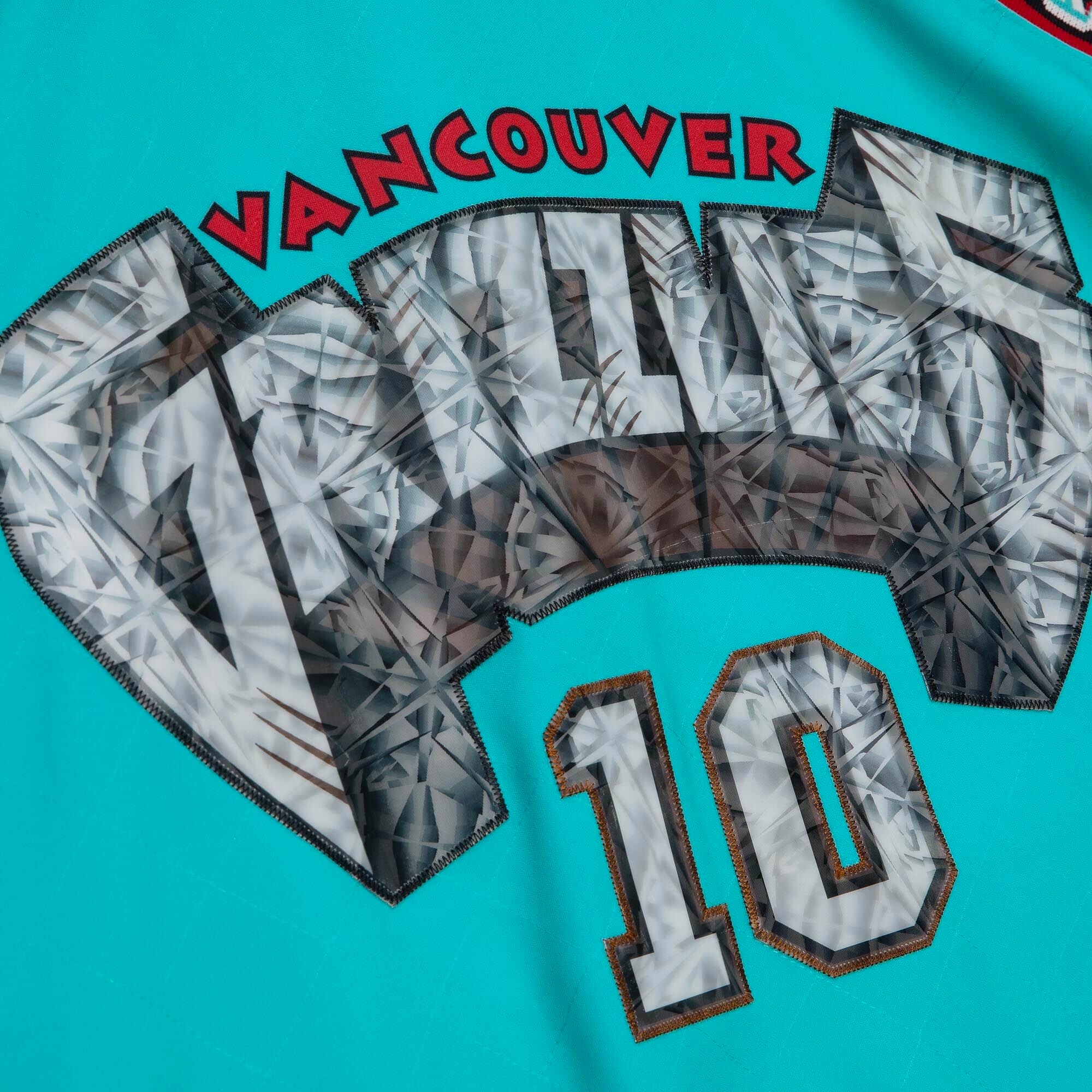 Mitchell & Ness Mens Mike Bibbly 75th Anniversary Vancouver Grizzlies Swingman Jersey