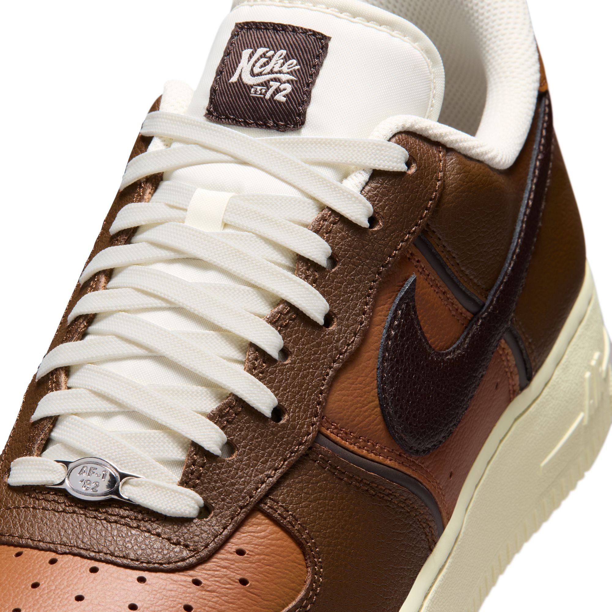 brown and tan sneakers on a white background