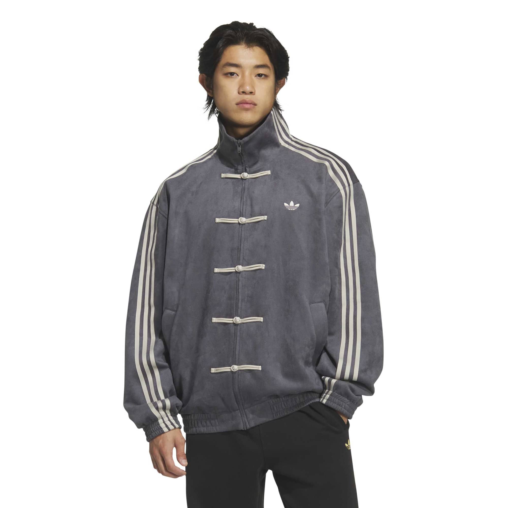 person wearing a grey jacket on a white background